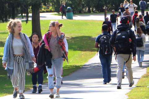 Students walking down a path outside at Macdonald Campus