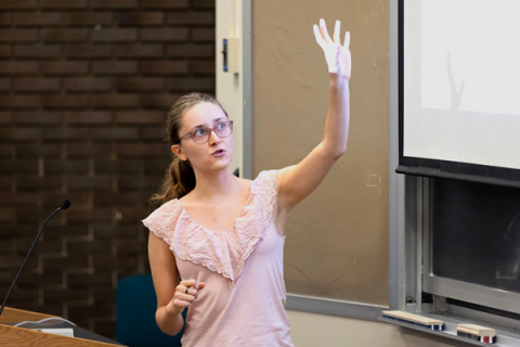 Female student gives a lecture