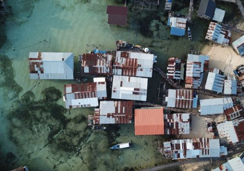 houses and buildings on the shoreline in the Caribbean