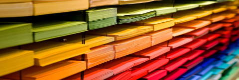 Rainbow-coloured stacks of papers