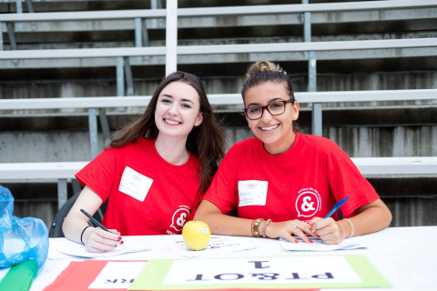 two student volunteers tabling at discover mcgill