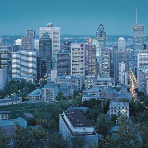 A photo of Montreal's city skyline at dusk.
